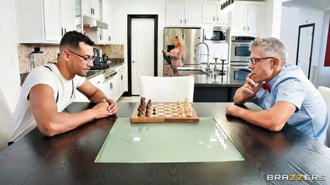 Muscular young stud and older man play chess as naked blonde bubble butt teases in kitchen doorway