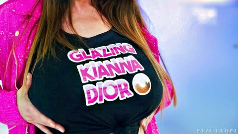 Busty Kianna Dior in tight black top, pushing up big tits in pink jacket
