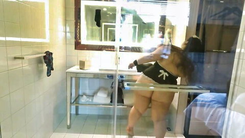 BBW bending over showing massive ass and curves in sexy black dress