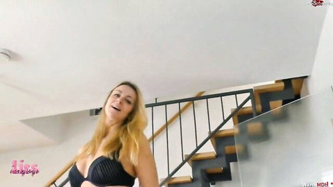 Blonde LissLonglegs in sexy black bra lingerie, smiling seductively