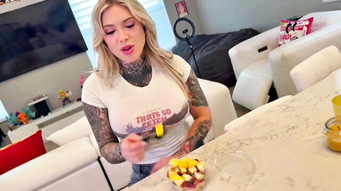 Christina Savoy blonde tattooed babe in crop top holding fruit tease