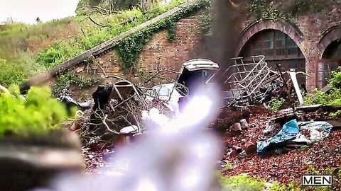 Young skinny gay couple rough outdoor sex in wild abandoned junkyard with old cars