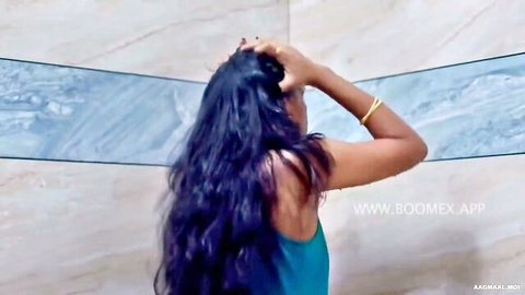 Sexy MILF with long dark hair in blue tank top, teasing in bathroom HD