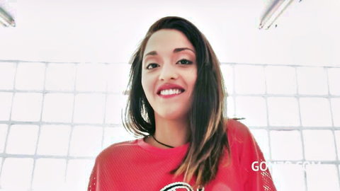 Scarlet Domingo smiling in red top, previewing first double penetration and anal gape