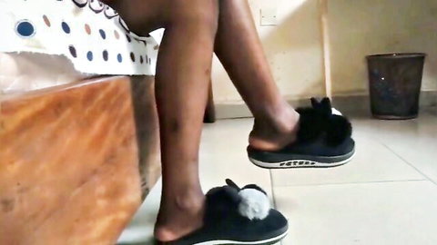 Nigerian maid teasing with legs spread in polka dot bottoms and fluffy bunny slippers
