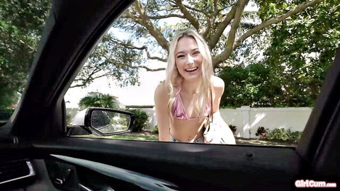 Blonde hitchhiker in pink bikini leans into car for Tony Rubino's blowjob