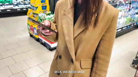 Brunette babe in tan coat teases craving milk selfie in supermarket