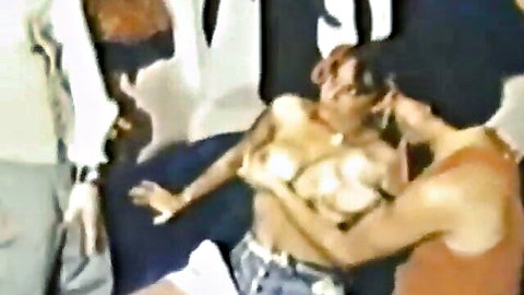 Busty ebony woman with huge natural tits groped by multiple hands in bedroom