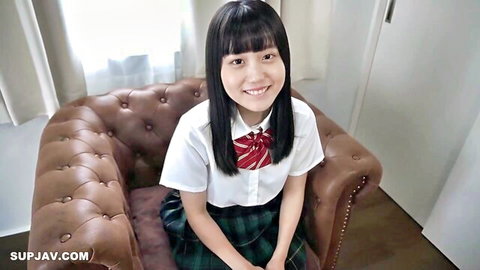 Cute Japanese schoolgirl in uniform smiling seductively for uncensored blowjob