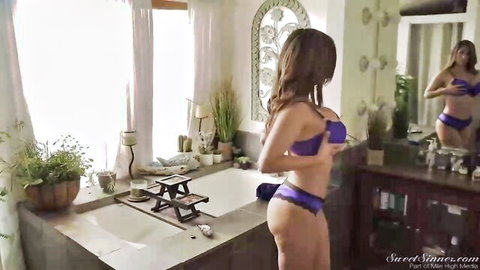 Tanned brunette MILF in purple bra and thong bending over bathtub showing big ass