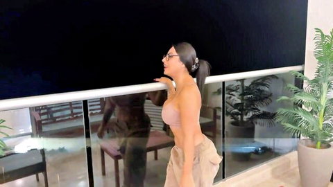 Evaa as naughty neighbor teasing on balcony, curvy Latina in pink top and pants