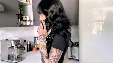 Tattooed Aurora Anarchy in black top, black hair, kitchen tease POV