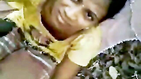 Indian woman in yellow top lying seductively outdoors POV view