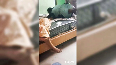 Hot Tamil aunty in orange dress enjoys threesome with two men on bed