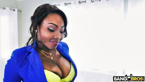 Osa Lovely in blue blazer and yellow bra, teasing big cleavage
