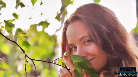 Katya Clover teases with natural beauty outdoors, smelling leaf before stripping