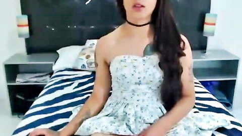 Shemale in floral strapless dress masturbates solo, long hair trans beauty stroking
