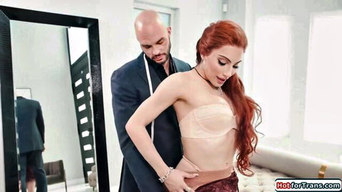 Ariel Demure in lacy bra and skirt, touched by suited personal shopper