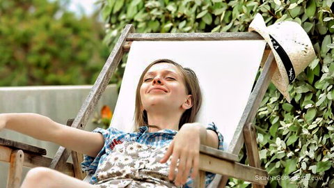 Kylie lounging relaxed in floral dress, solo tease in HD porn
