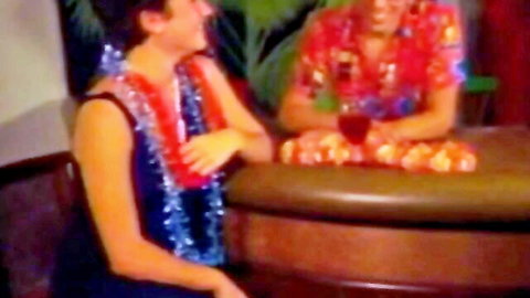 Retro Hawaiian babes in colorful leis and dresses at bar, teasing before dildo action