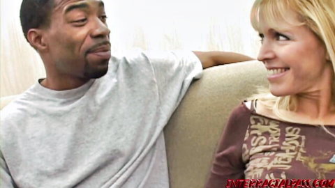 Nicole Moore smiles with black stud Boz on couch, interracial tease