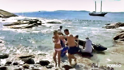 Blonde babe in pink bikini with three guys in wild outdoor beach group sex