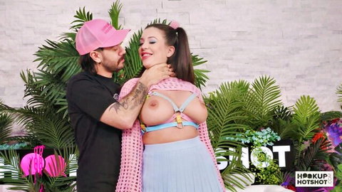 Elizabeth Skylar milf with exposed big tits in pink harness, choked by guy in HookupHotShot scene