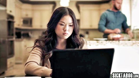 Lulu Chu petite Asian teen at laptop in cozy sweater, man nearby
