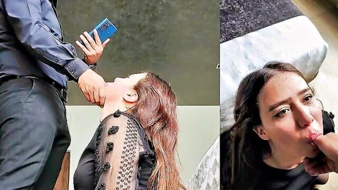 Dominant man grips submissive woman's chin forcing her mouth wide open while holding phone, babe licks thick finger teasingly