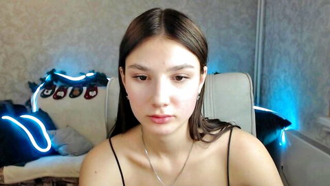 Lovelylavender brunette camgirl in tank top, teasing on Chaturbate