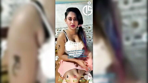 Divyanshi aka Bernita Biswas in revealing tank top and mini skirt, teasing pose