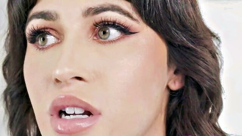 Brunette bombshell with glossy plump lips parted wide in moaning ecstasy closeup