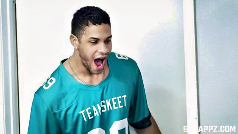 Black stud in Team Skeet Jaguars jersey yells with mouth wide open ready for rough action