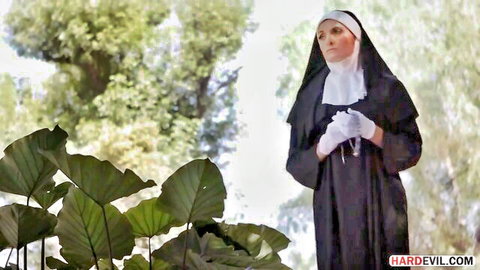 Silvia Saige as sinful nun in black habit and gloves, outdoor tease