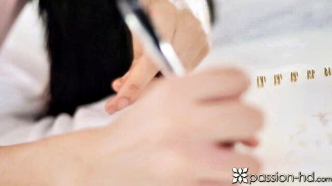 Intimate Asian woman with long dark hair writing on paper in bed, PassionHD