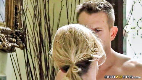 Blonde ponytail MILF stares intensely at shirtless muscular stud in luxurious room