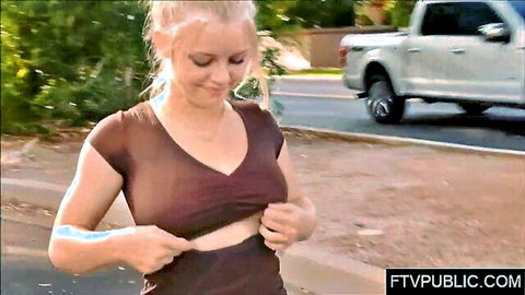 Blonde babe pulls open maroon top flashing huge bare tits on public street near truck
