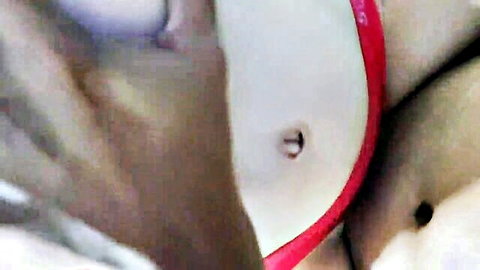 Closeup of shaved young pussy with white thong pulled aside and navel piercing visible