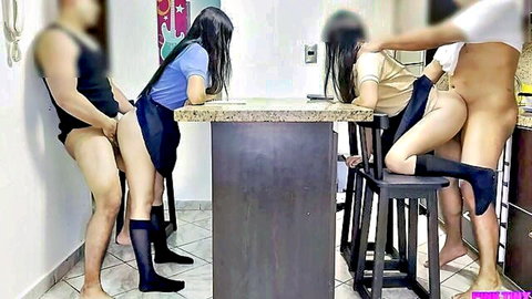 Two Asian schoolgirls in skirts bent over kitchen counter fucked doggy style by big cocks
