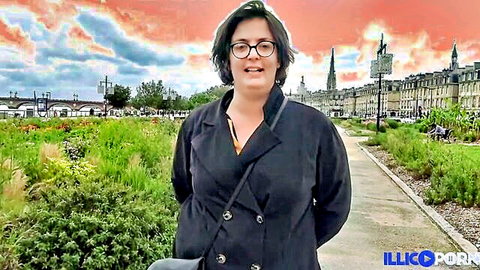 Curvy mature Barbara in black coat, teasing outdoors at sunset