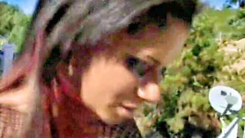 Sexy redbone ebony with long dark hair smiles outdoors, tight ass tease