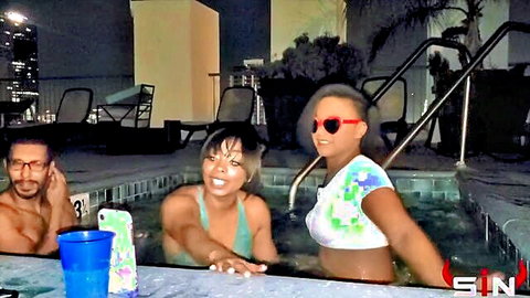 Bikini babes and hunk playfully splashing in hot tub threesome tease