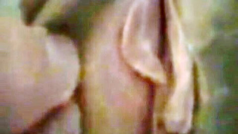 Blurry close-up of mature woman's sticky wet pussy