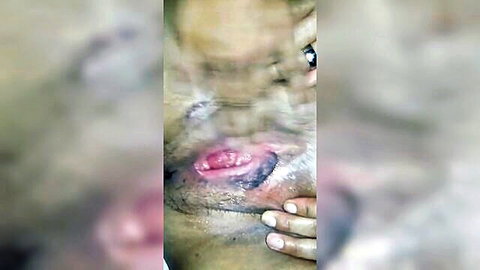 Close-up of wet mature ebony pussy with large labia and scars