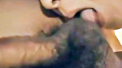 Japanese mature woman giving intense blowjob close-up