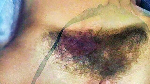 Close-up of big hairy pussy with thick bush