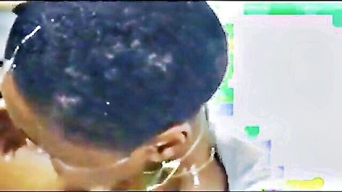 Ebony woman in white top smiling, preview for cum shower scene