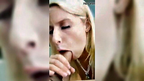 Close-up of blonde woman with hand on mouth in explicit oral scene