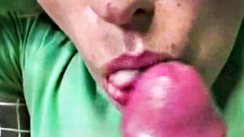 Close-up of woman deepthroating pink dildo with saliva