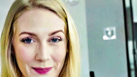 Close-up of sexy smiling blonde woman with plump red lips and blue eyes